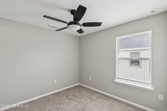 7802 Merchants Way, Jacksonville, FL 32222 - spare room featuring a ceiling fan, baseboards, light colored carpet, and visible vents