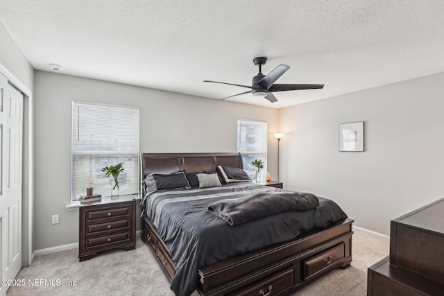 7802 Merchants Way, Jacksonville, FL 32222 - bedroom featuring baseboards, a textured ceiling, ceiling fan, and light colored carpet