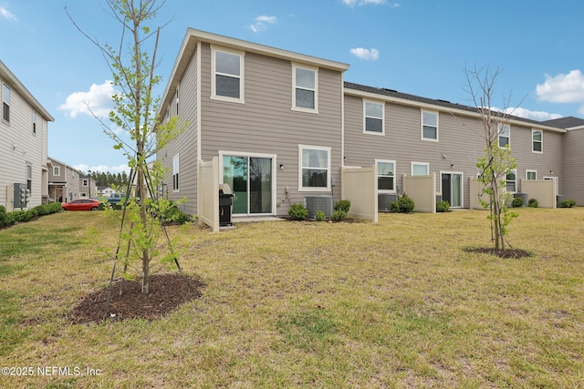 7802 Merchants Way, Jacksonville, FL 32222 - rear view of property with cooling unit and a yard