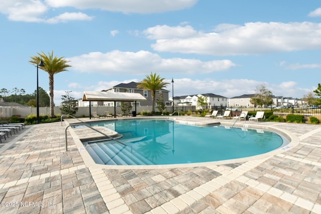 7802 Merchants Way, Jacksonville, FL 32222 - community pool featuring a residential view, fence, and a patio area