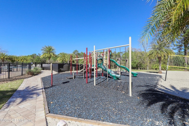 communal playground featuring fence