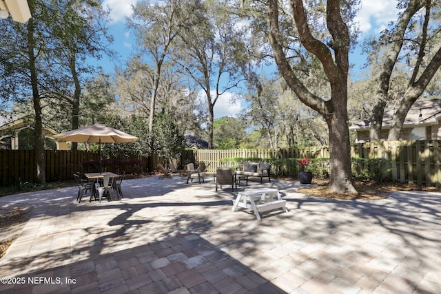 view of patio / terrace with a fenced backyard and outdoor dining space