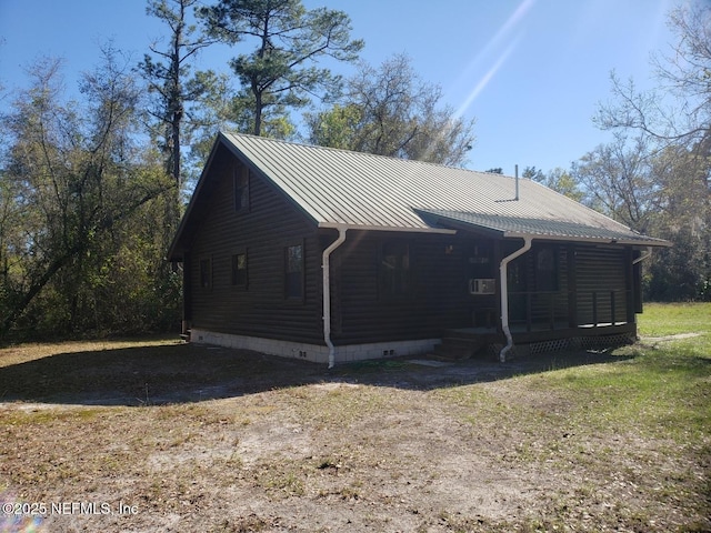 exterior space featuring metal roof and a standing seam roof