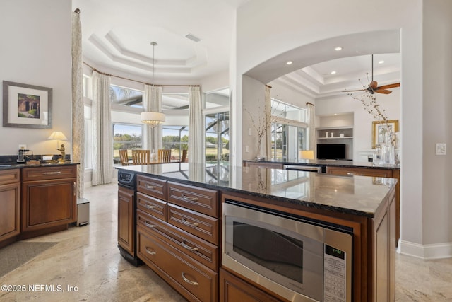 1193 Queens Harbor Blvd, Jacksonville, FL 32225 - kitchen featuring stainless steel microwave, a raised ceiling, plenty of natural light, and visible vents