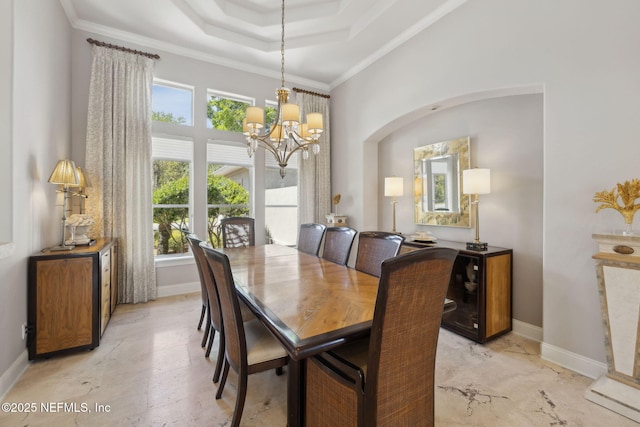1193 Queens Harbor Blvd, Jacksonville, FL 32225 - dining room with ornamental molding, a notable chandelier, a tray ceiling, and baseboards