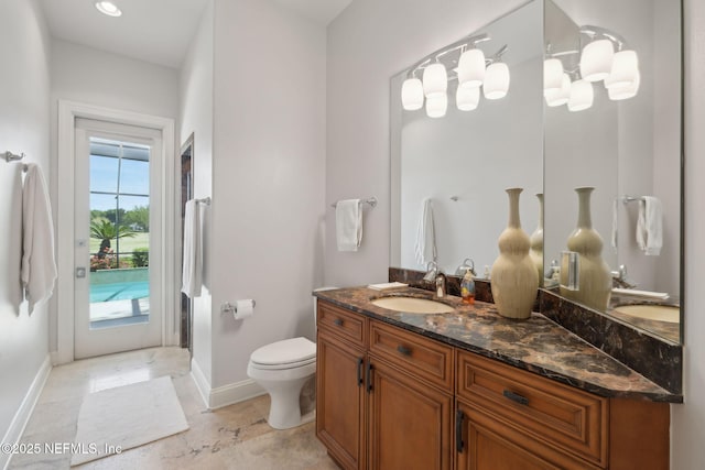 1193 Queens Harbor Blvd, Jacksonville, FL 32225 - bathroom featuring toilet, vanity, and baseboards