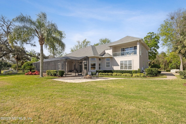 1193 Queens Harbor Blvd, Jacksonville, FL 32225 - rear view of property with glass enclosure, a lawn, stucco siding, and a patio area