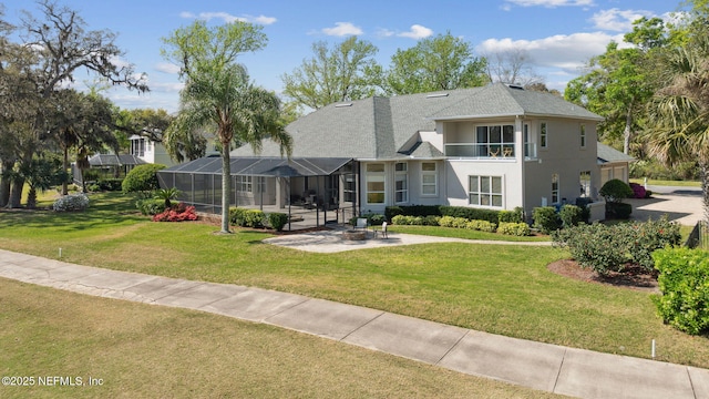 1193 Queens Harbor Blvd, Jacksonville, FL 32225 - exterior space featuring a lanai, a front yard, stucco siding, a shingled roof, and a patio area