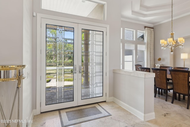1193 Queens Harbor Blvd, Jacksonville, FL 32225 - entrance foyer with baseboards, a wealth of natural light, french doors, and a notable chandelier