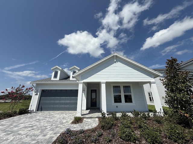 294 Lamego Ln, Saint Augustine, FL 32095 - view of front of property featuring a porch, an attached garage, and decorative driveway