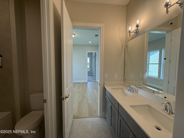 294 Lamego Ln, Saint Augustine, FL 32095 - bathroom with double vanity, a bathtub, and tile patterned flooring