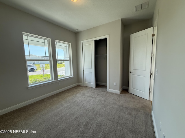 294 Lamego Ln, Saint Augustine, FL 32095 - unfurnished bedroom with carpet and a closet