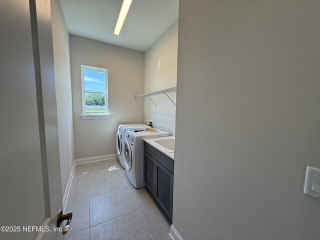 294 Lamego Ln, Saint Augustine, FL 32095 - laundry room with cabinet space, independent washer and dryer, and light tile patterned floors