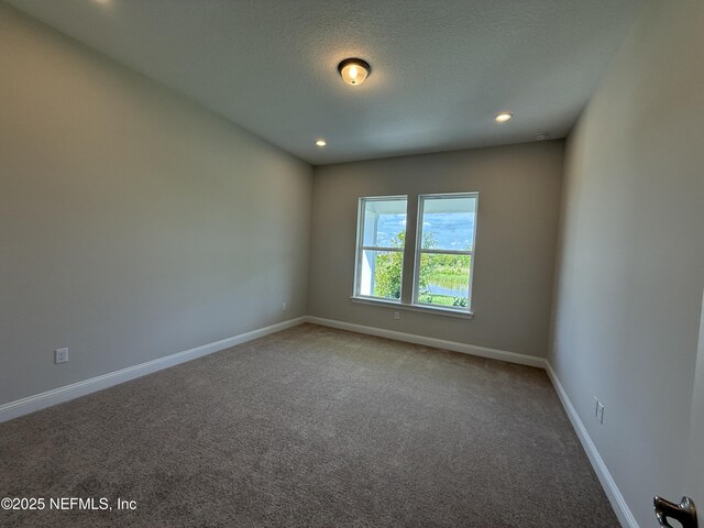294 Lamego Ln, Saint Augustine, FL 32095 - unfurnished room with carpet, recessed lighting, and a textured ceiling