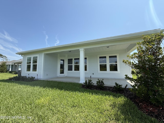 294 Lamego Ln, Saint Augustine, FL 32095 - back of property with a yard and covered porch