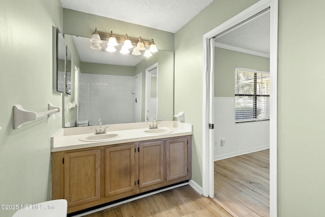7552 Pottsburg Landing Dr, Jacksonville, FL 32216 - bathroom with walk in shower, a sink, and a textured ceiling
