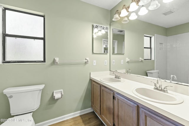 7552 Pottsburg Landing Dr, Jacksonville, FL 32216 - bathroom featuring toilet, a sink, baseboards, and visible vents