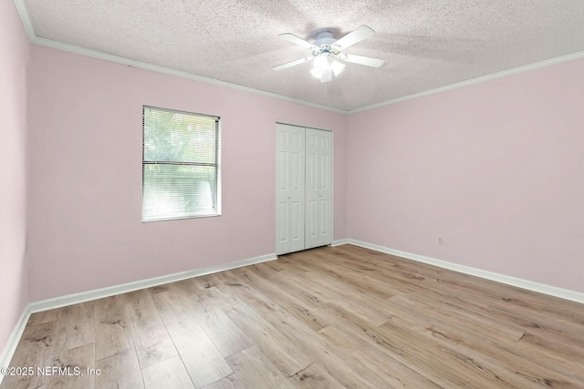 7552 Pottsburg Landing Dr, Jacksonville, FL 32216 - unfurnished bedroom with ornamental molding, baseboards, a closet, and light wood-type flooring