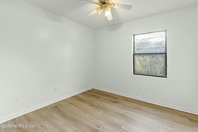 7552 Pottsburg Landing Dr, Jacksonville, FL 32216 - empty room with baseboards, a textured ceiling, wood finished floors, and ceiling fan