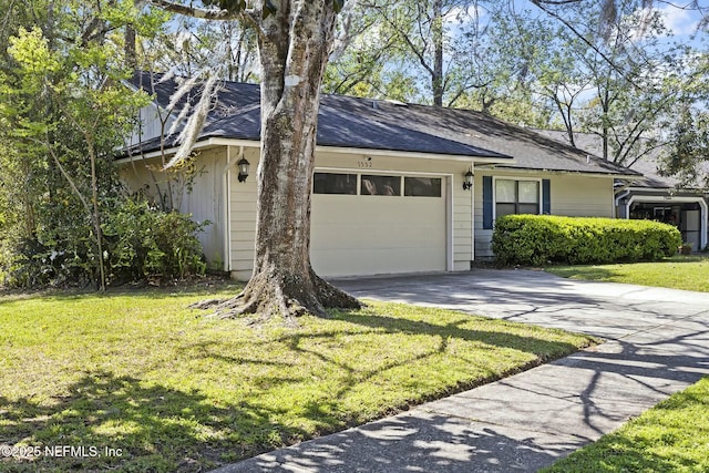 7552 Pottsburg Landing Dr, Jacksonville, FL 32216 - view of front of house featuring a garage, roof with shingles, concrete driveway, and a front yard