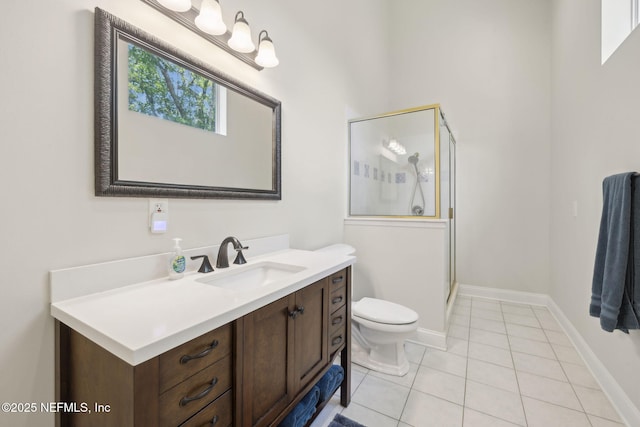 full bathroom featuring vanity, baseboards, tile patterned flooring, toilet, and a shower stall