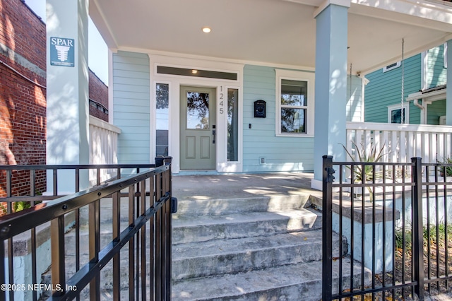 property entrance featuring covered porch