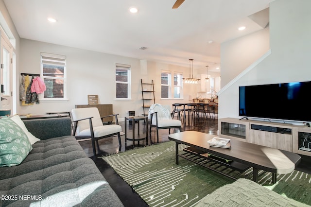 living area with visible vents, ceiling fan, and recessed lighting