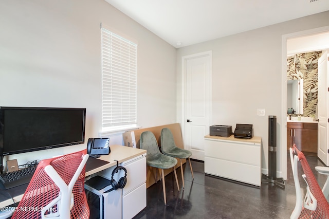 home office featuring finished concrete floors