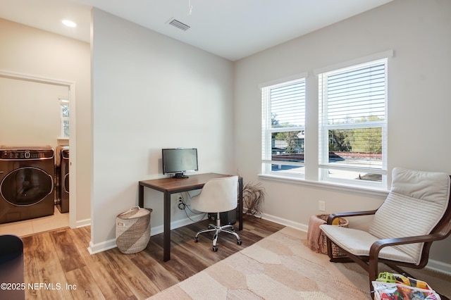 office space with washing machine and dryer, wood finished floors, baseboards, visible vents, and recessed lighting