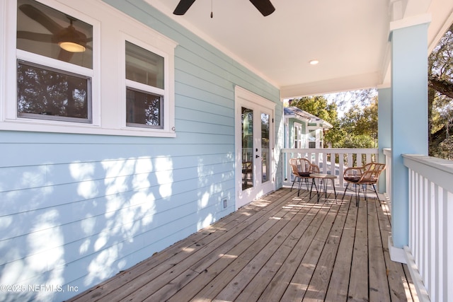 wooden terrace featuring ceiling fan