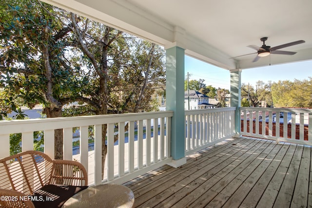 wooden terrace with a ceiling fan