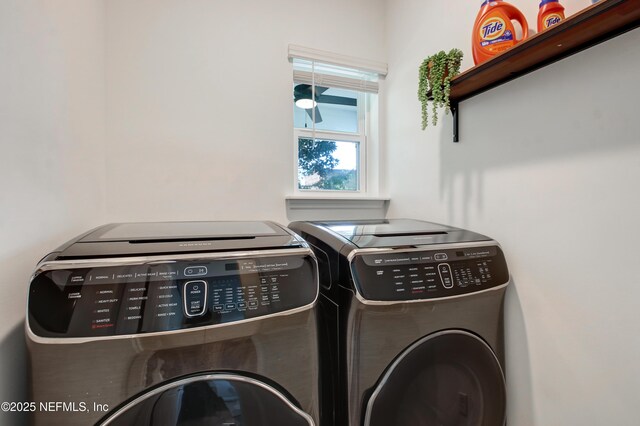 laundry area with washing machine and clothes dryer and laundry area