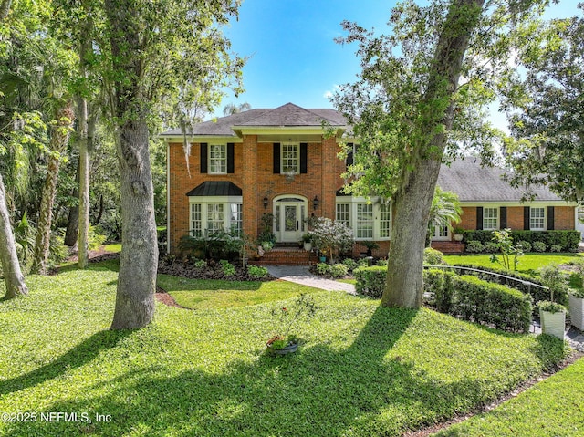 6260 Highlands Ct, Ponte Vedra Beach, FL 32082 - colonial inspired home featuring brick siding and a front lawn