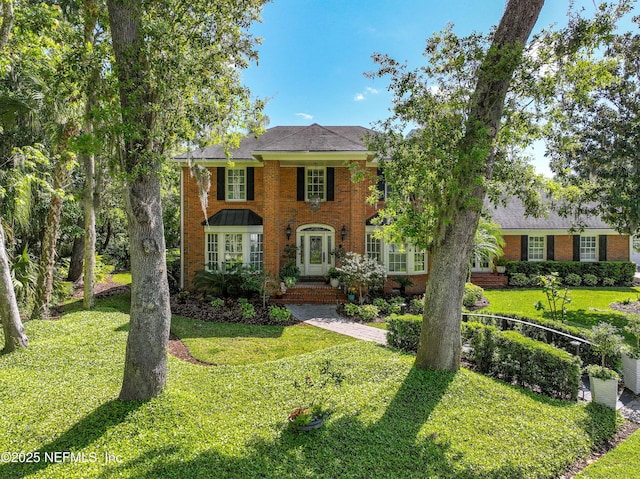 6260 Highlands Ct, Ponte Vedra Beach, FL 32082 - colonial-style house with brick siding and a front yard