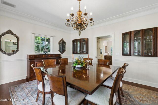 6260 Highlands Ct, Ponte Vedra Beach, FL 32082 - dining room featuring a chandelier, baseboards, ornamental molding, and wood finished floors