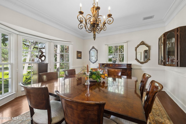 6260 Highlands Ct, Ponte Vedra Beach, FL 32082 - dining area with a chandelier, plenty of natural light, crown molding, and wood finished floors