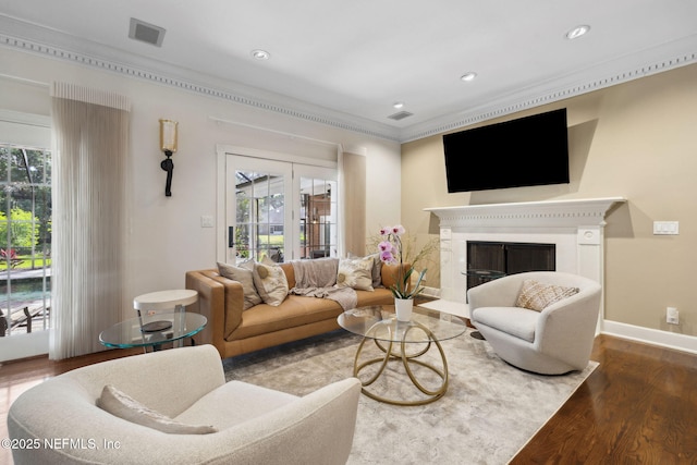 6260 Highlands Ct, Ponte Vedra Beach, FL 32082 - living room with wood finished floors, plenty of natural light, ornamental molding, a fireplace with flush hearth, and recessed lighting
