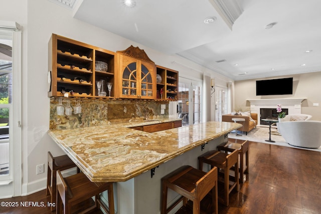 6260 Highlands Ct, Ponte Vedra Beach, FL 32082 - kitchen with open shelves, dark wood finished floors, a kitchen breakfast bar, backsplash, and recessed lighting