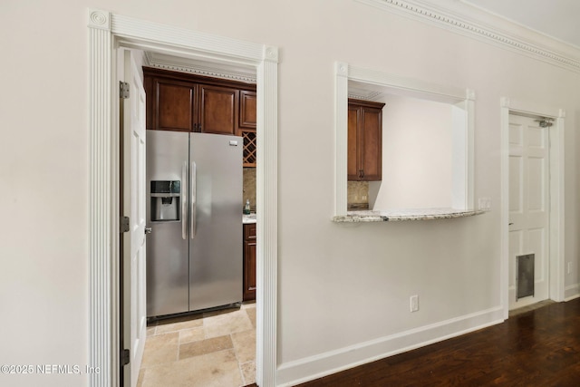 6260 Highlands Ct, Ponte Vedra Beach, FL 32082 - kitchen with stainless steel fridge with ice dispenser, baseboards, and light stone counters