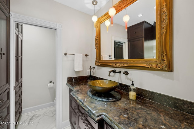 6260 Highlands Ct, Ponte Vedra Beach, FL 32082 - bathroom featuring marble look tiles, vanity, and baseboards