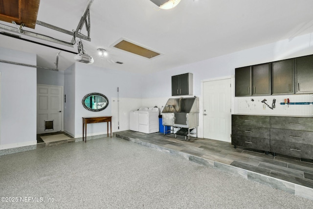 6260 Highlands Ct, Ponte Vedra Beach, FL 32082 - garage with independent washer and dryer, a garage door opener, and baseboards