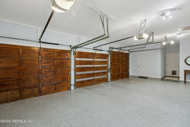 6260 Highlands Ct, Ponte Vedra Beach, FL 32082 - garage with a garage door opener and baseboards
