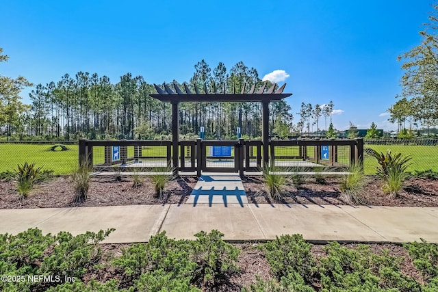 75586 Pondside Ln, Yulee, FL 32097 - view of property's community featuring a lawn, a gate, and fence