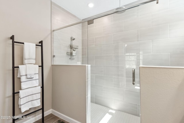75586 Pondside Ln, Yulee, FL 32097 - bathroom with a stall shower and wood finished floors