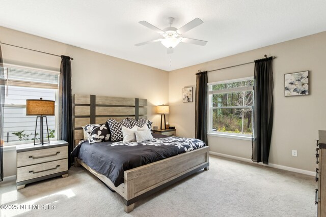 75586 Pondside Ln, Yulee, FL 32097 - bedroom with baseboards, a ceiling fan, and light colored carpet