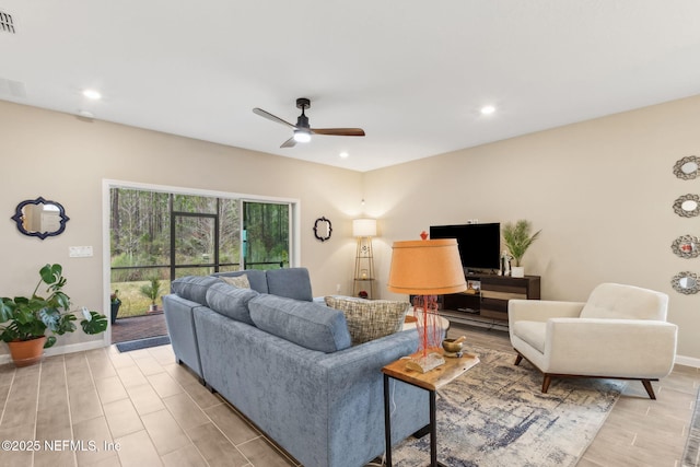 75586 Pondside Ln, Yulee, FL 32097 - living room with light wood-style flooring, visible vents, baseboards, recessed lighting, and a ceiling fan