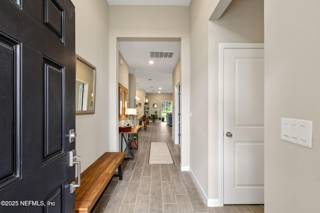 75586 Pondside Ln, Yulee, FL 32097 - entrance foyer featuring baseboards, visible vents, and wood finish floors