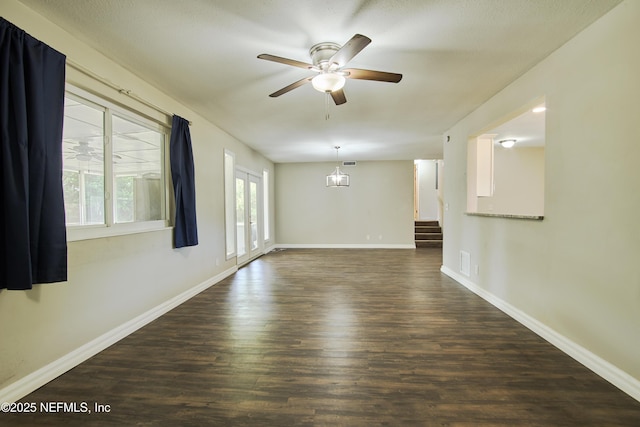 10568 Lake View Rd E, Jacksonville, FL 32225 - spare room with visible vents, baseboards, stairway, a ceiling fan, and dark wood-style floors