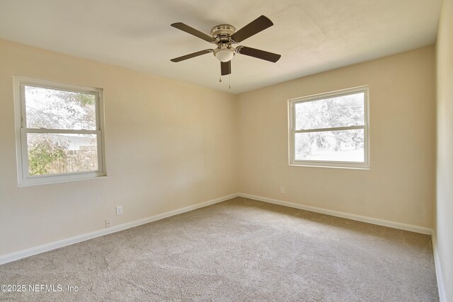 10568 Lake View Rd E, Jacksonville, FL 32225 - carpeted empty room featuring baseboards and ceiling fan