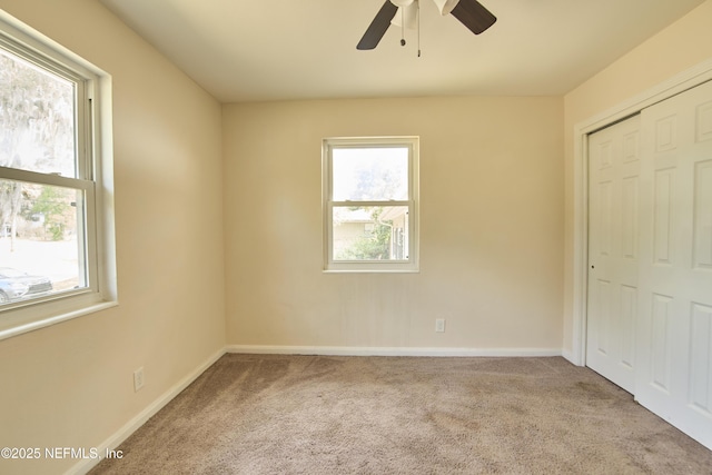 10568 Lake View Rd E, Jacksonville, FL 32225 - spare room featuring a wealth of natural light, carpet flooring, and a ceiling fan